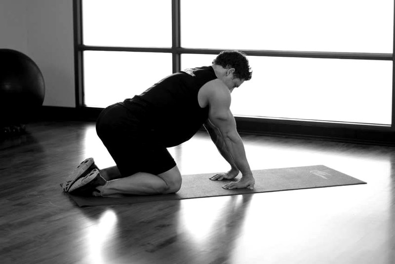 Kneeling Forearm Stretch — end position demonstration photo