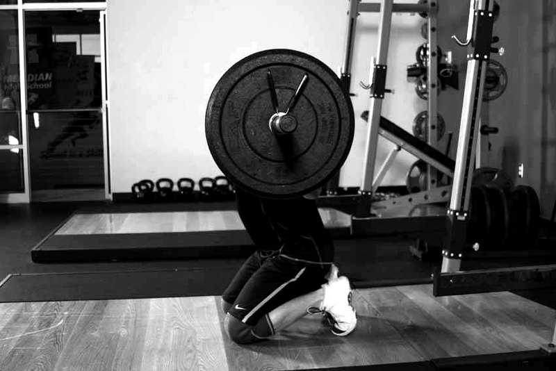 Kneeling Jump Squat — end position demonstration photo