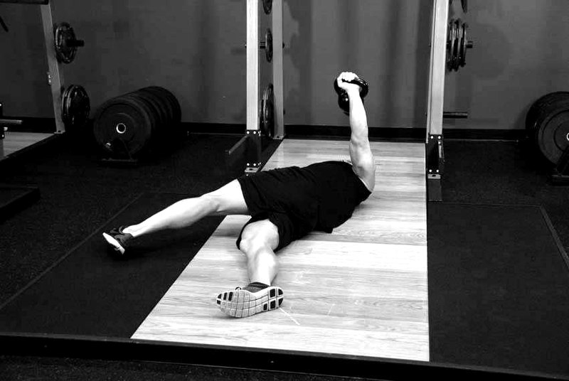 Leg-Over Floor Press — end position demonstration photo