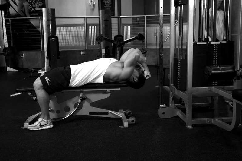 Lying Close-Grip Bar Curl On High Pulley — end position demonstration photo