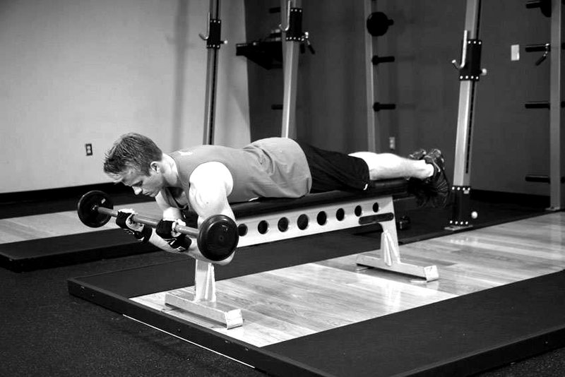 Lying High Bench Barbell Curl — end position demonstration photo