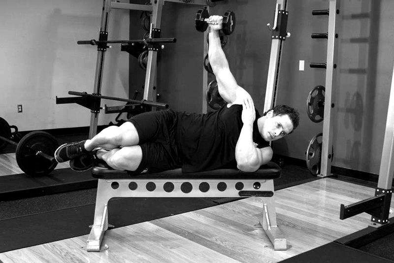 Lying One-Arm Lateral Raise — end position demonstration photo