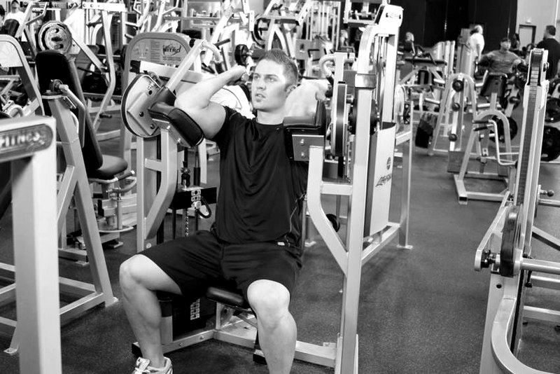 Machine Bicep Curl — end position demonstration photo