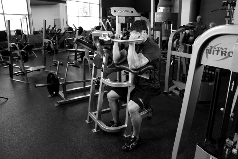 Machine Preacher Curls — end position demonstration photo
