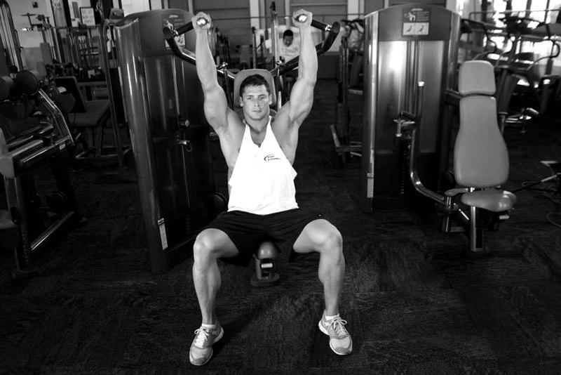 Machine Shoulder (Military) Press — end position demonstration photo