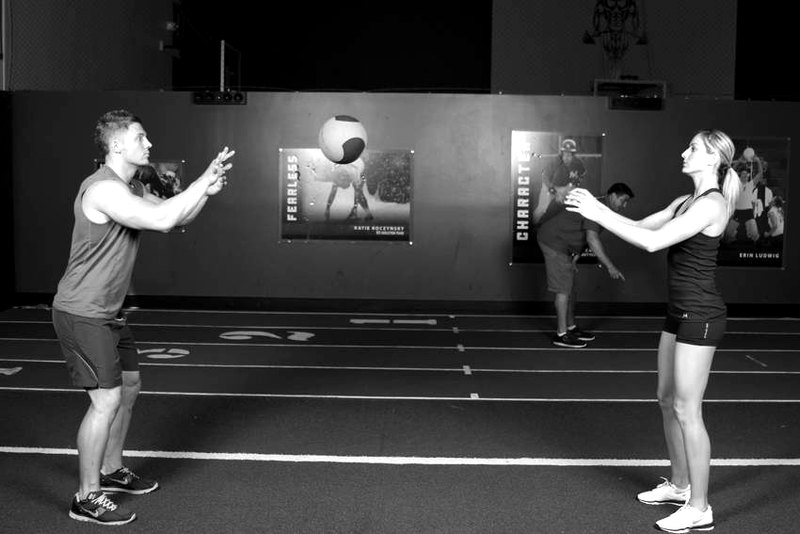 Medicine Ball Chest Pass — end position demonstration photo