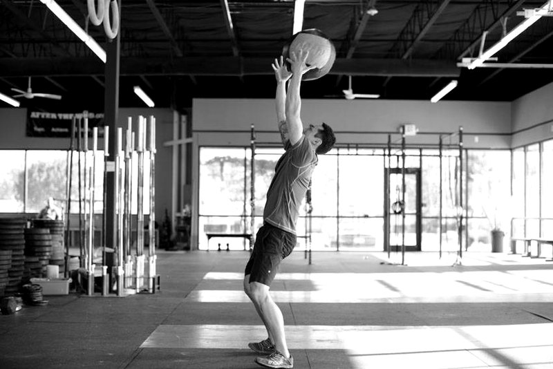 Medicine Ball Scoop Throw — end position demonstration photo