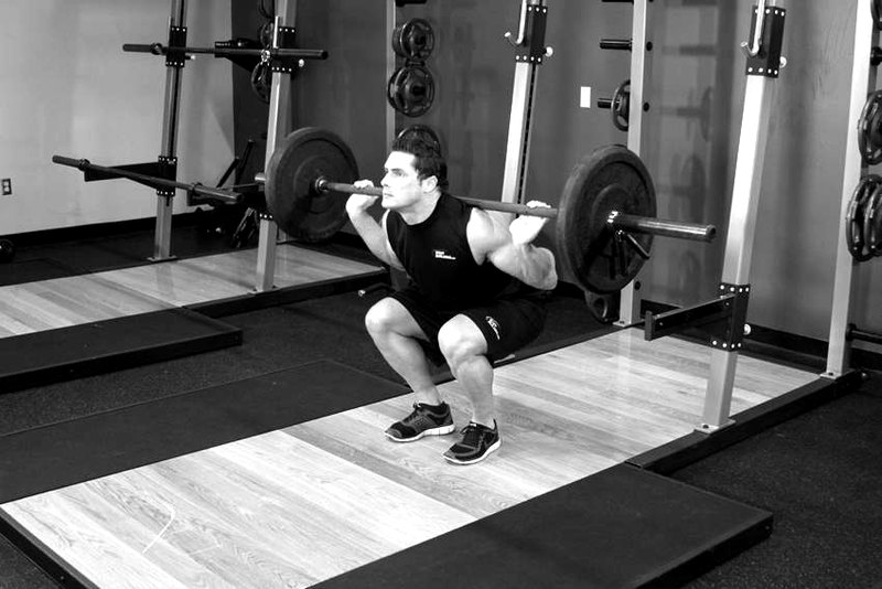 Narrow Stance Squats — end position demonstration photo