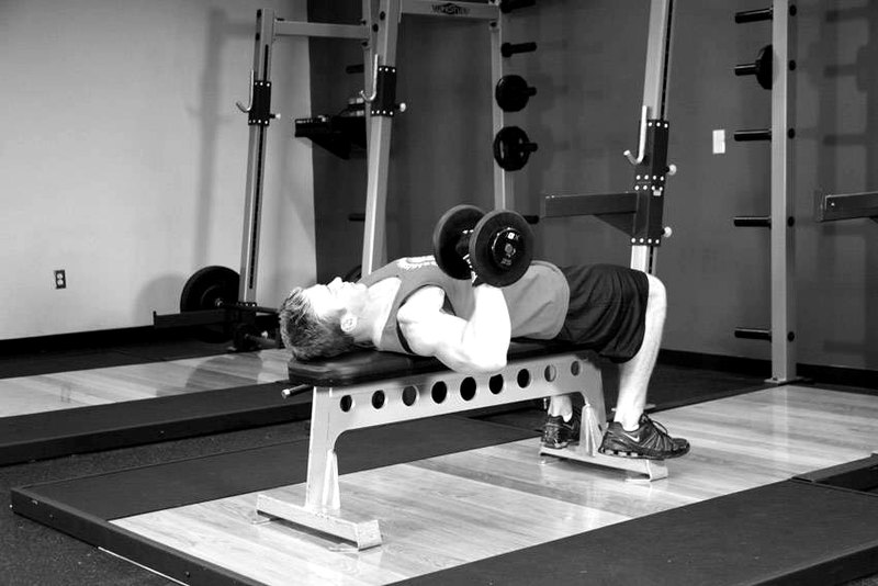 One Arm Dumbbell Bench Press — start position demonstration photo