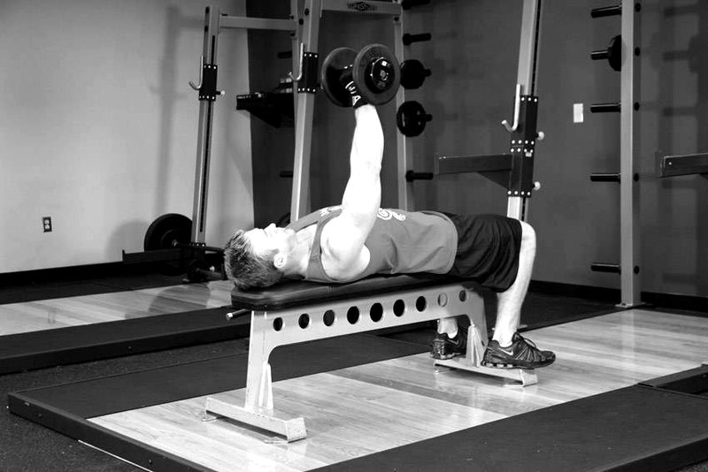 One Arm Dumbbell Bench Press — end position demonstration photo