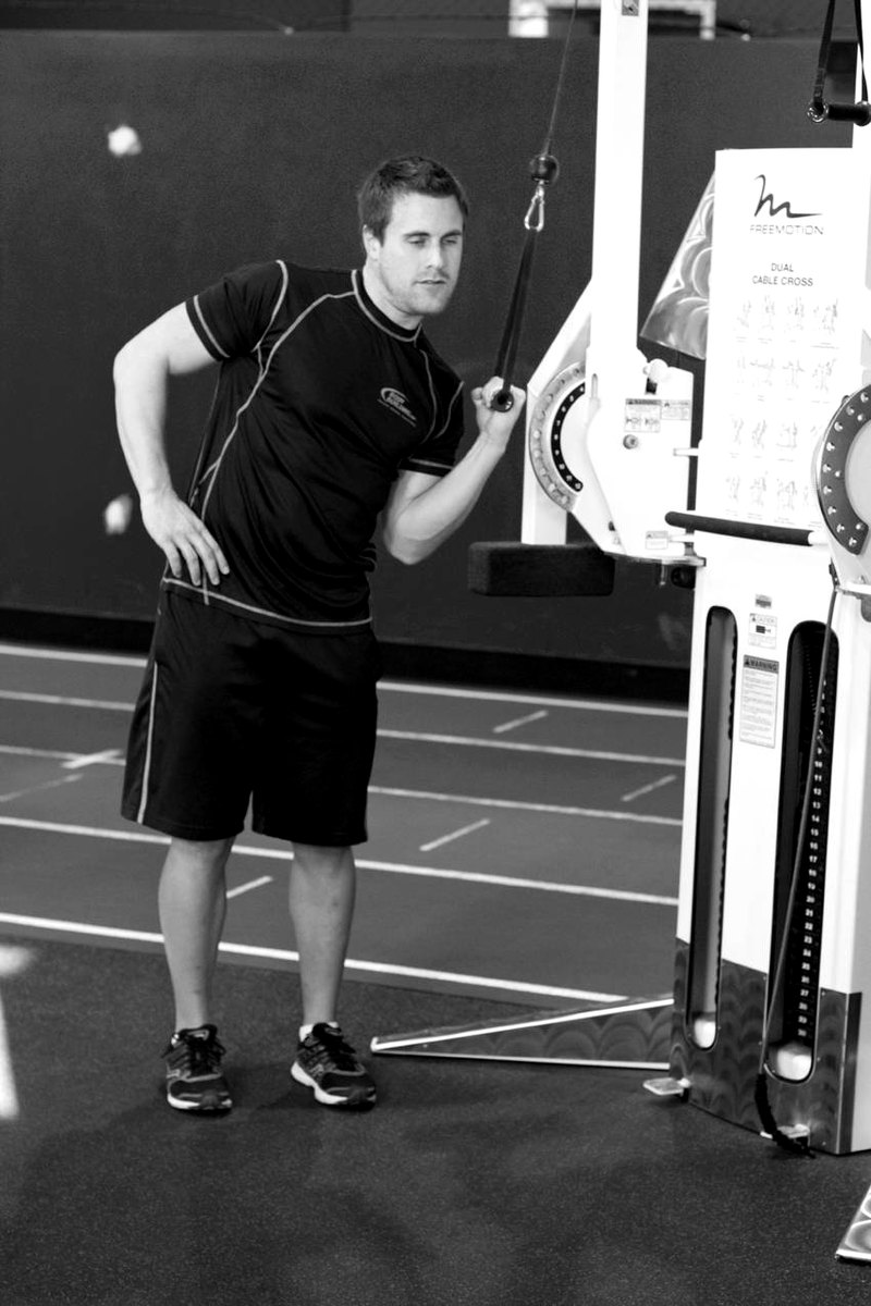 One-Arm High-Pulley Cable Side Bends — end position demonstration photo