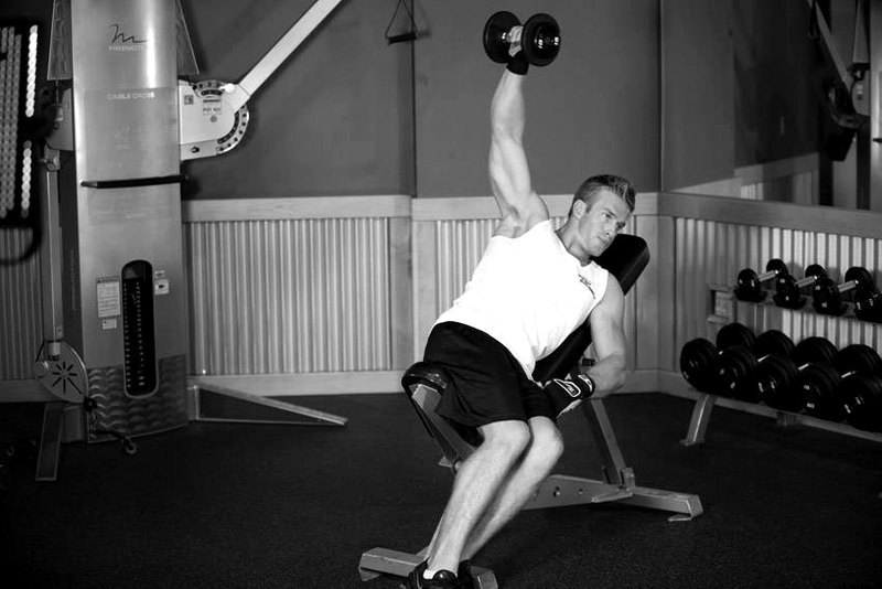 One-Arm Incline Lateral Raise — end position demonstration photo