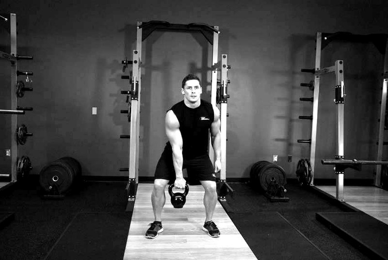 One-Arm Kettlebell Clean and Jerk — start position demonstration photo