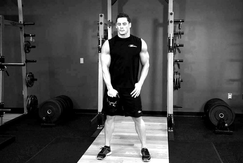 One-Arm Kettlebell Clean — start position demonstration photo