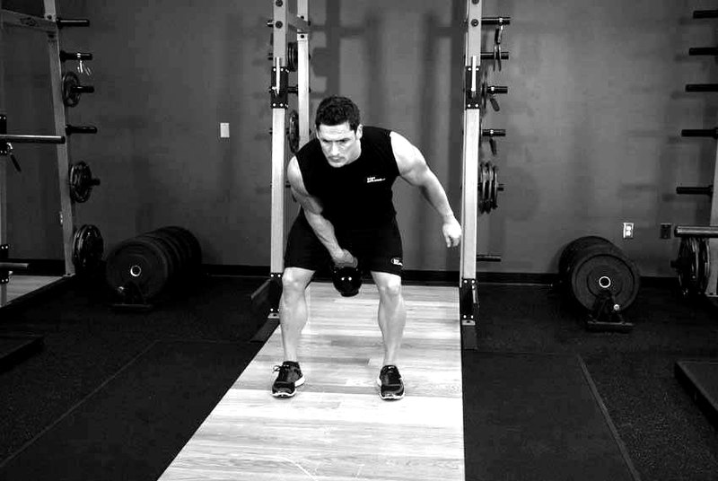 One-Arm Kettlebell Clean — end position demonstration photo