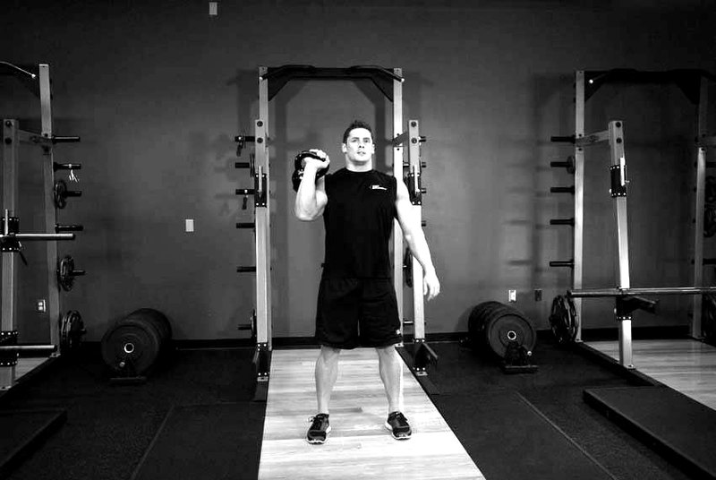 One-Arm Kettlebell Jerk — start position demonstration photo