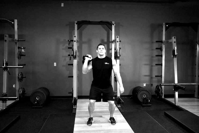 One-Arm Kettlebell Jerk — end position demonstration photo