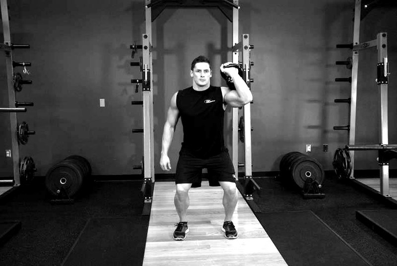 One-Arm Kettlebell Push Press — end position demonstration photo