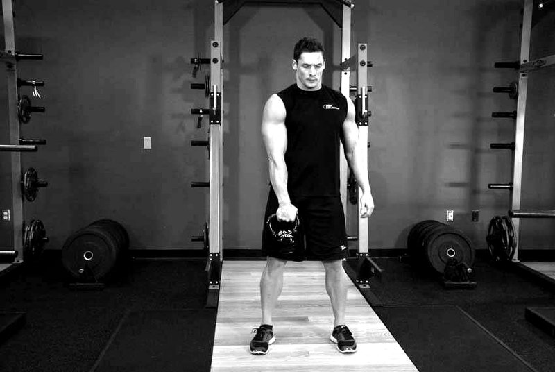 One-Arm Kettlebell Split Snatch — start position demonstration photo