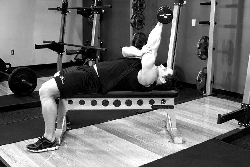 One Arm Pronated Dumbbell Triceps Extension — start position demonstration photo