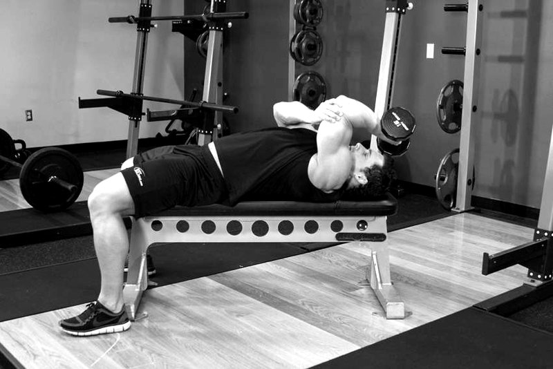 One Arm Pronated Dumbbell Triceps Extension — end position demonstration photo