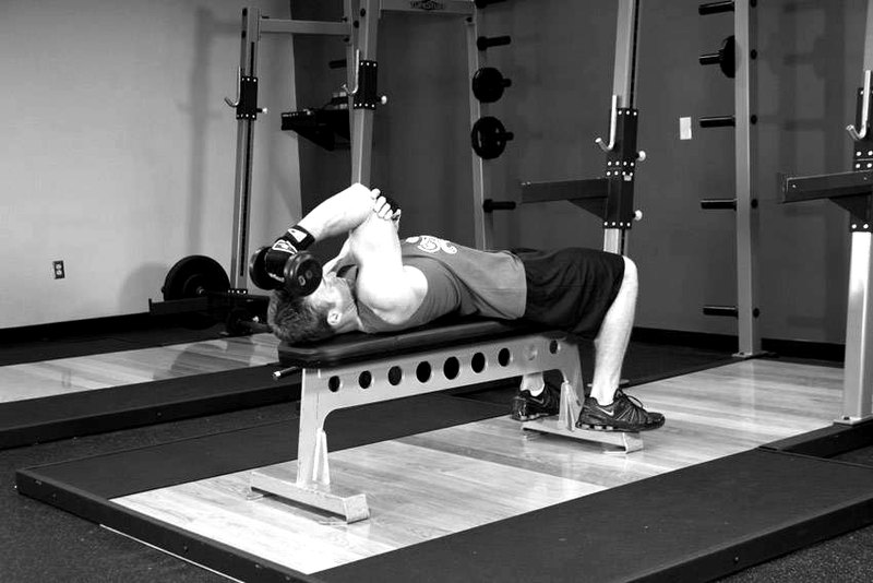 One Arm Supinated Dumbbell Triceps Extension — start position demonstration photo
