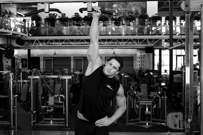 One Handed Hang — end position demonstration photo