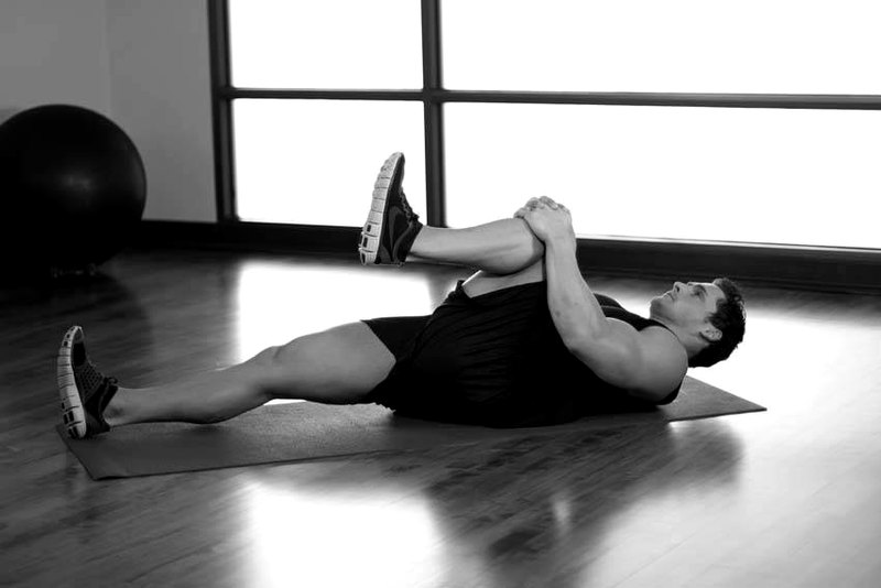 One Knee To Chest — end position demonstration photo