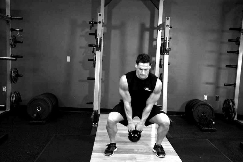 Open Palm Kettlebell Clean — start position demonstration photo