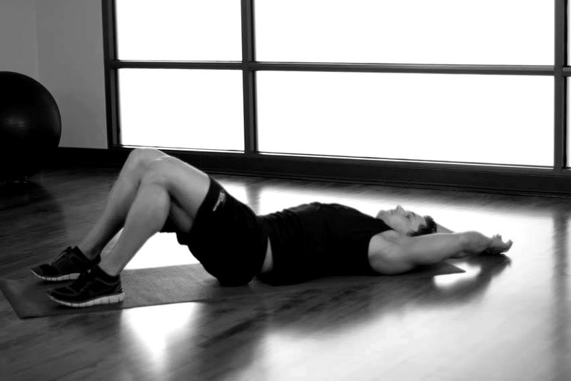 Pelvic Tilt Into Bridge — start position demonstration photo