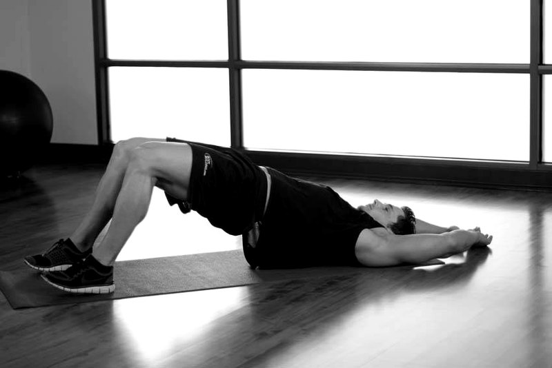 Pelvic Tilt Into Bridge — end position demonstration photo