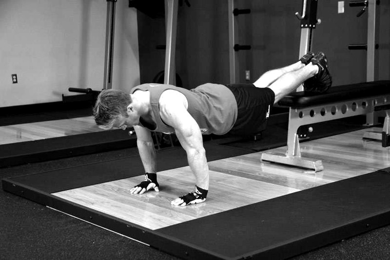 Push-Ups With Feet Elevated — start position demonstration photo