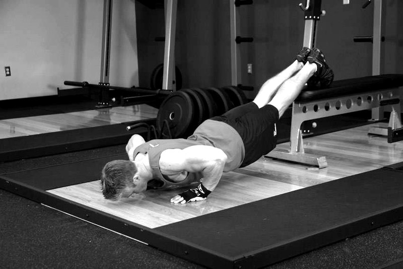 Push-Ups With Feet Elevated — end position demonstration photo