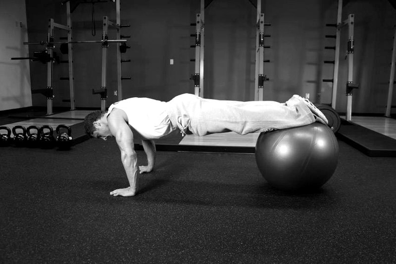 Push-Ups With Feet On An Exercise Ball — end position demonstration photo