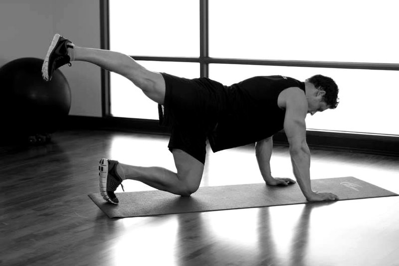 Rear Leg Raises — end position demonstration photo