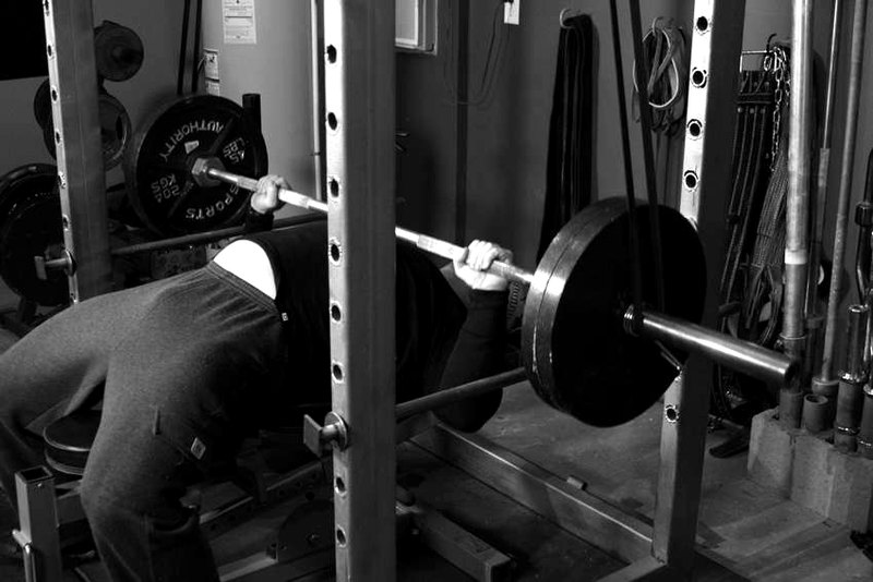 Reverse Band Bench Press — end position demonstration photo