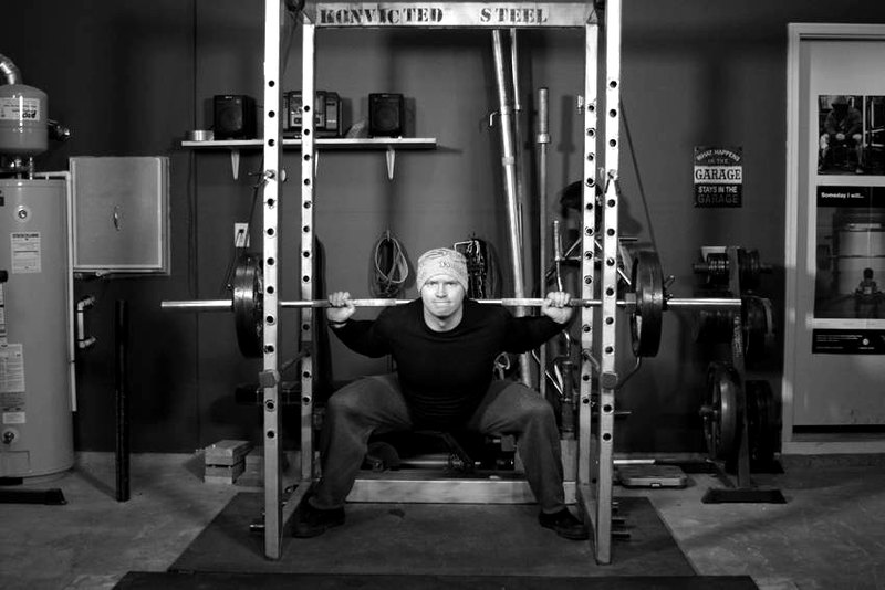 Reverse Band Power Squat — end position demonstration photo