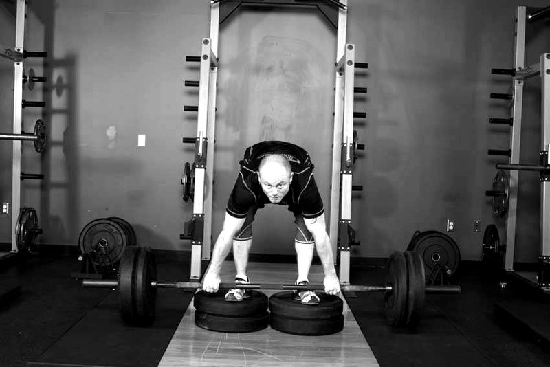 Romanian Deadlift from Deficit — end position demonstration photo
