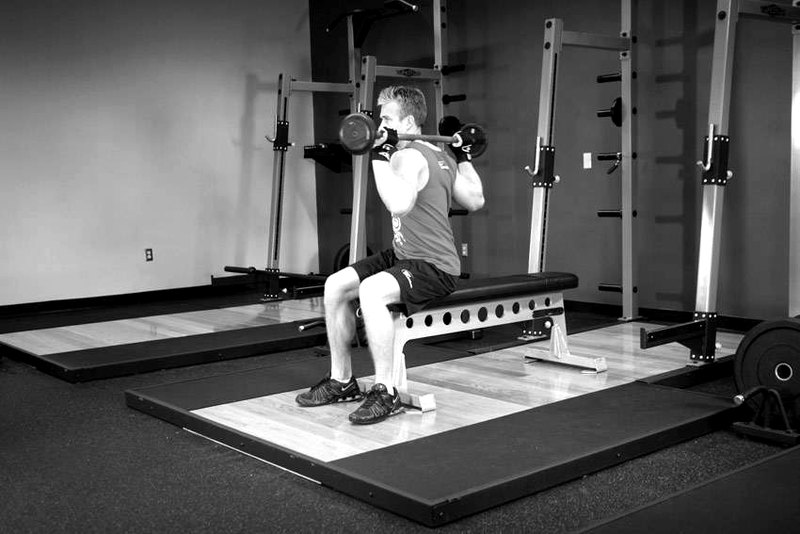 Seated Barbell Twist — start position demonstration photo