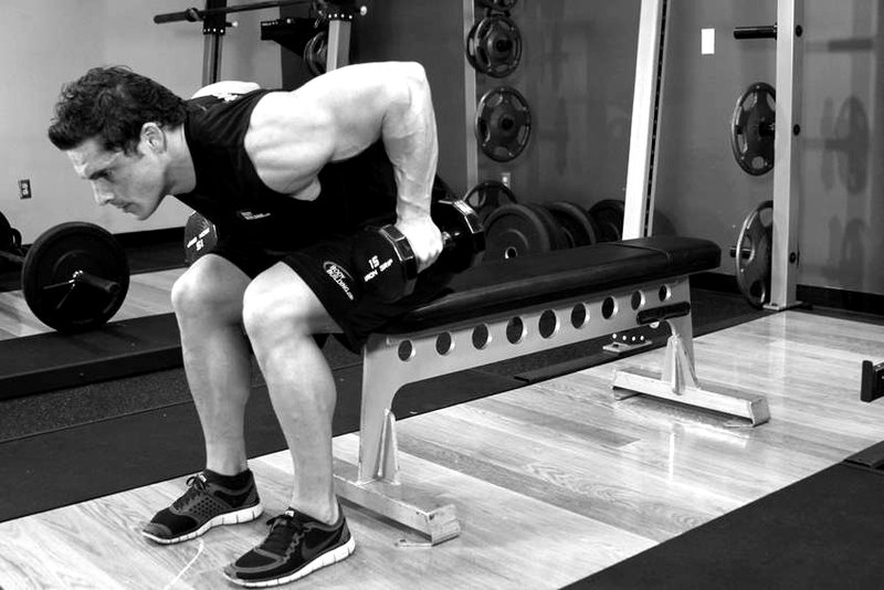 Seated Bent-Over Two-Arm Dumbbell Triceps Extension — start position demonstration photo