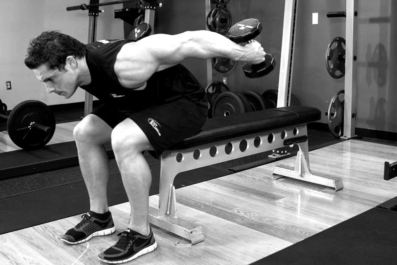 Seated Bent-Over Two-Arm Dumbbell Triceps Extension — end position demonstration photo