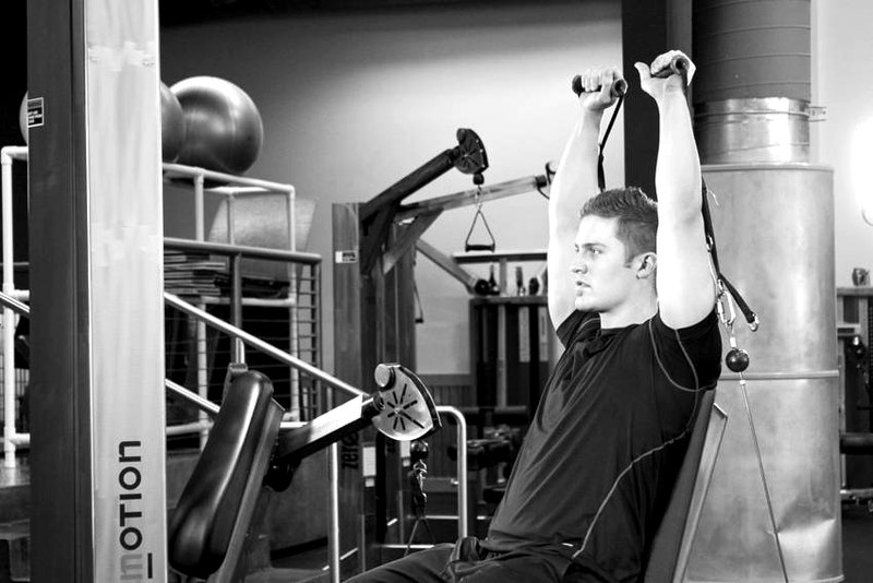 Seated Cable Shoulder Press — end position demonstration photo