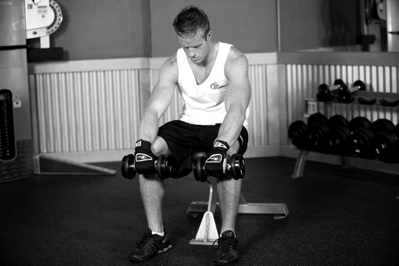 Seated Dumbbell Palms-Down Wrist Curl — start position demonstration photo