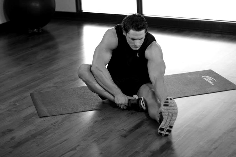 Seated Floor Hamstring Stretch — end position demonstration photo