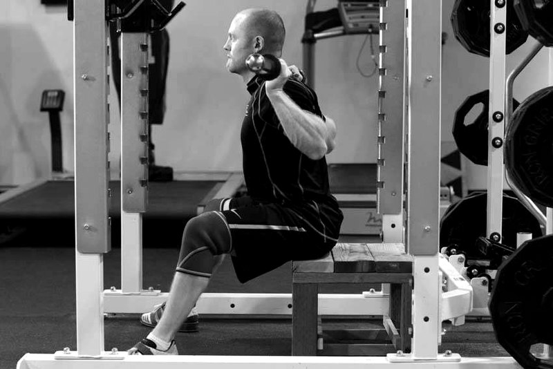 Seated Good Mornings — start position demonstration photo