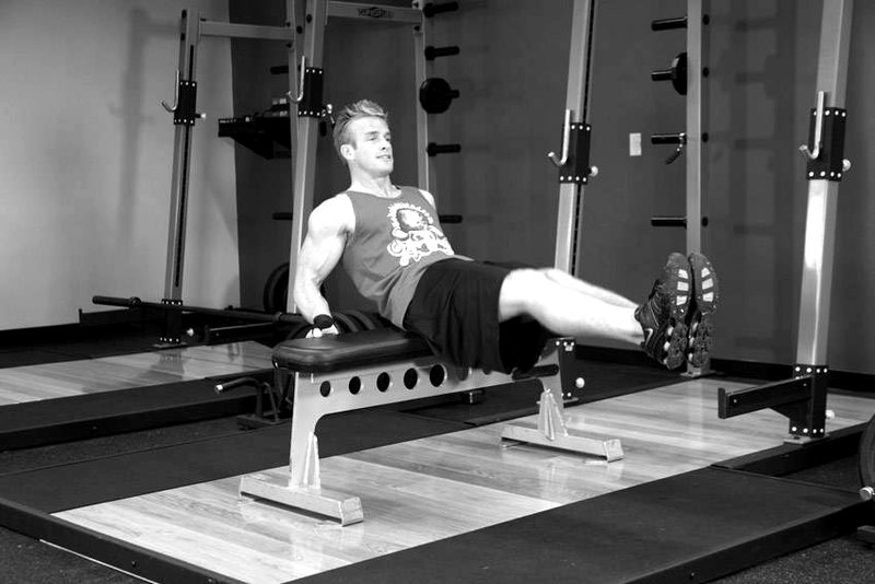 Seated Leg Tucks — end position demonstration photo