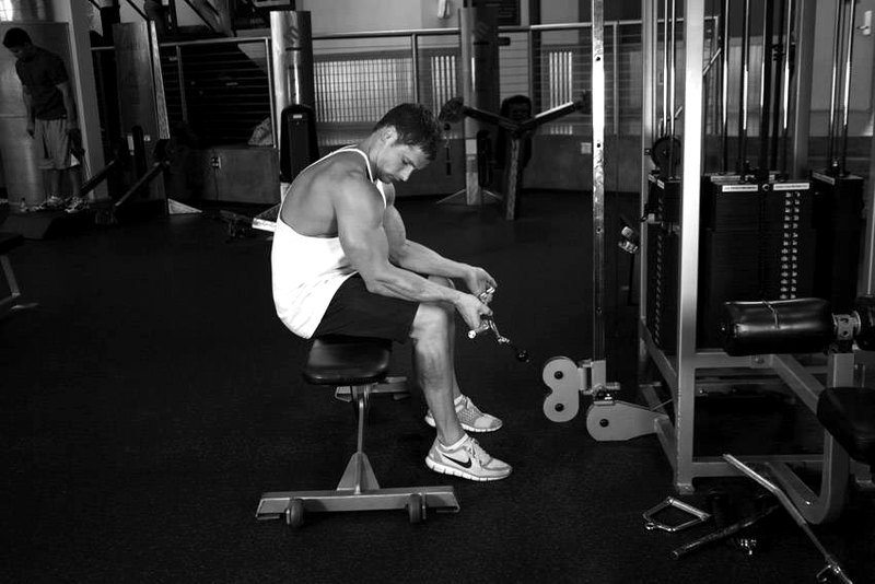 Seated Two-Arm Palms-Up Low-Pulley Wrist Curl — start position demonstration photo