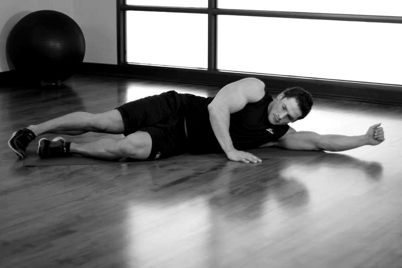 Side-Lying Floor Stretch — start position demonstration photo