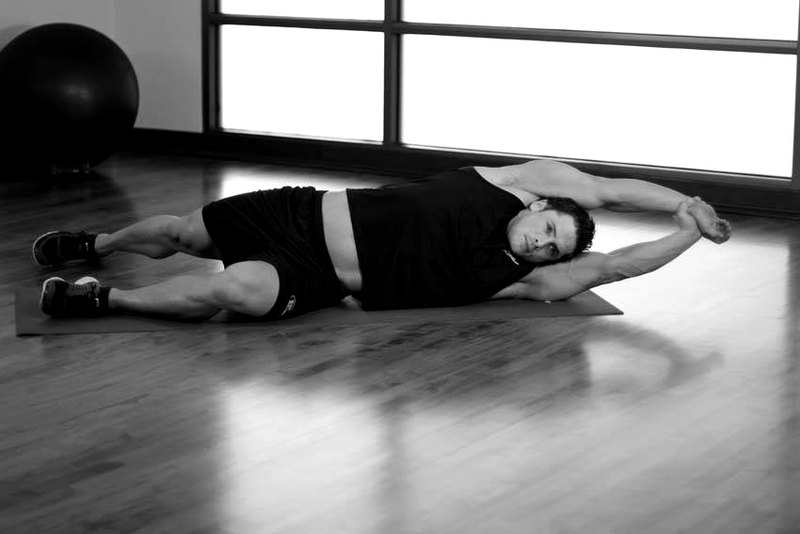 Side-Lying Floor Stretch — end position demonstration photo