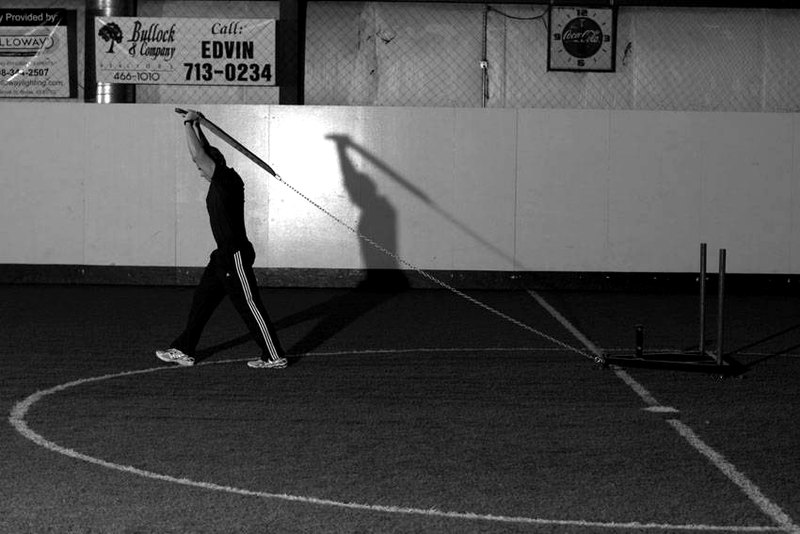 Sled Overhead Triceps Extension — end position demonstration photo